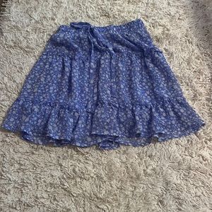 Short blue skirt with white flowers